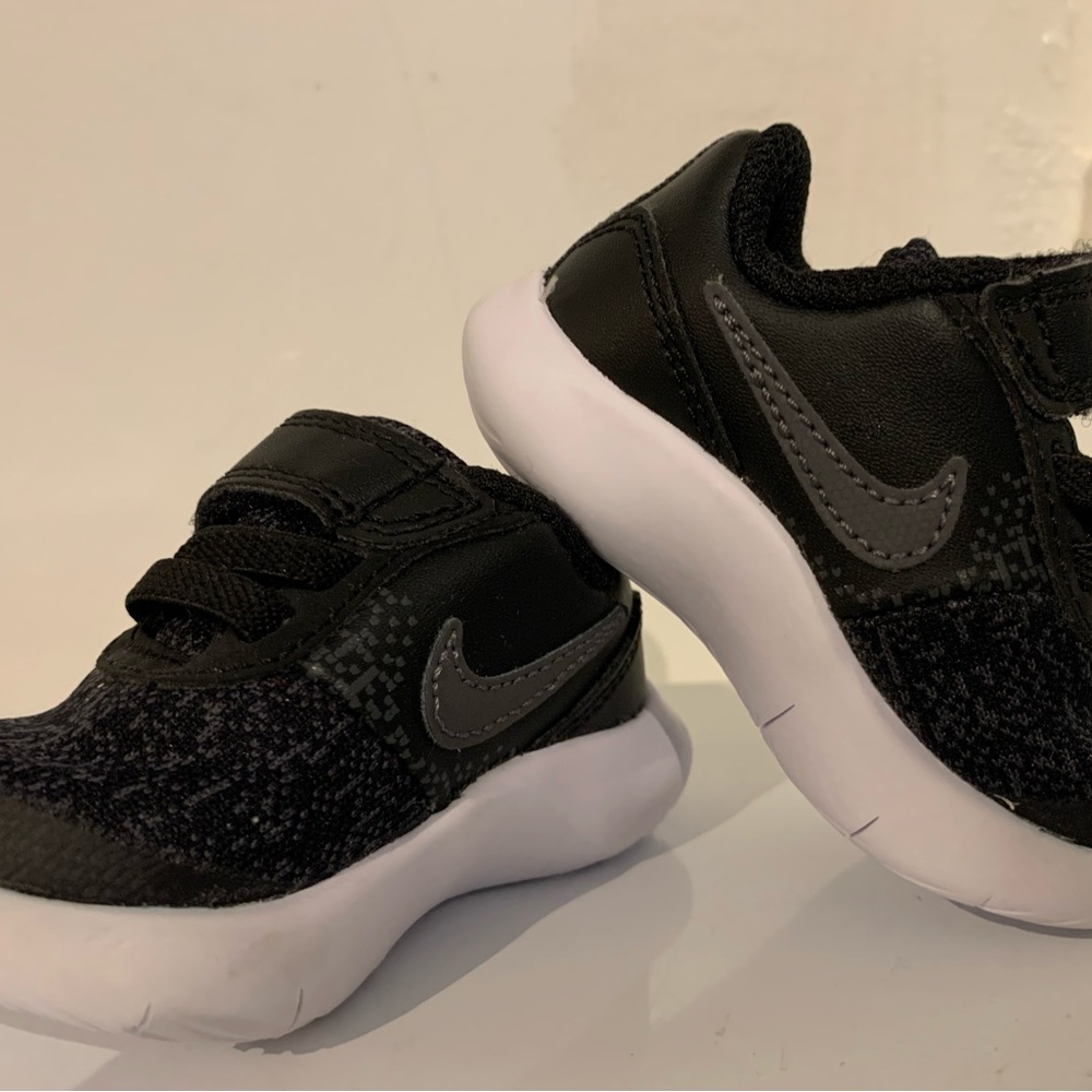 Adorable black Nike shoes for baby